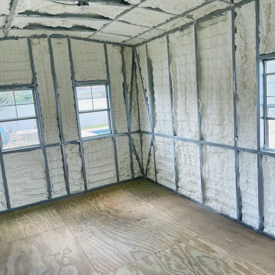 Closed-cell spray foam insulation applied to wall cavities in a residential project in Braddock